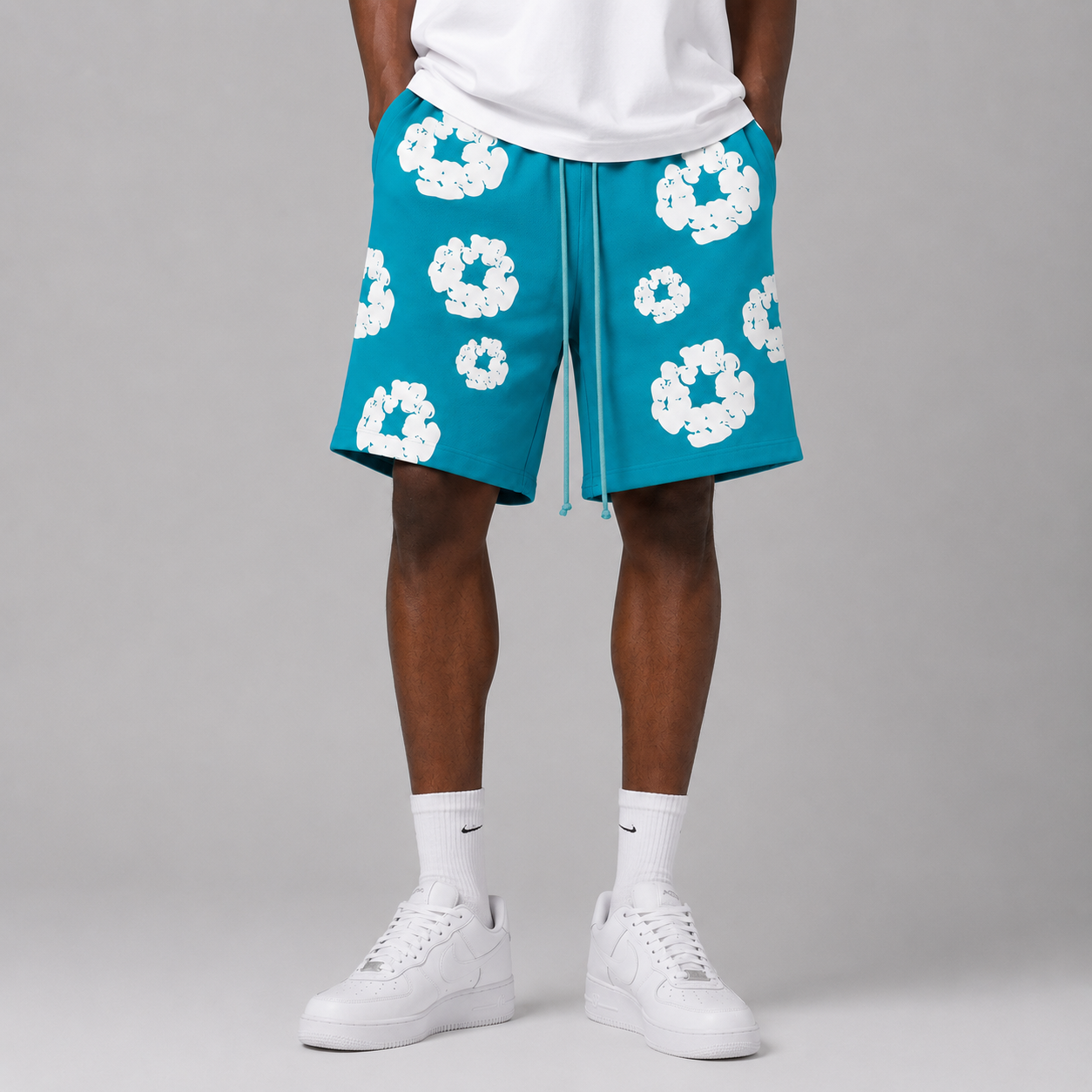 Teal White Puff Floral mesh shorts - flat-lay view