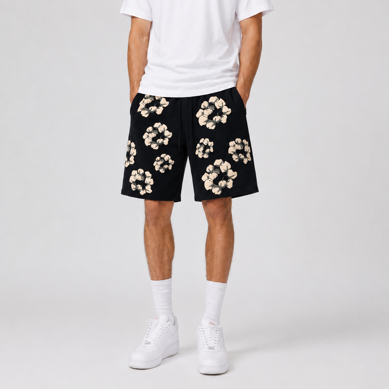 Black Cream Floral mesh shorts - flat-lay view