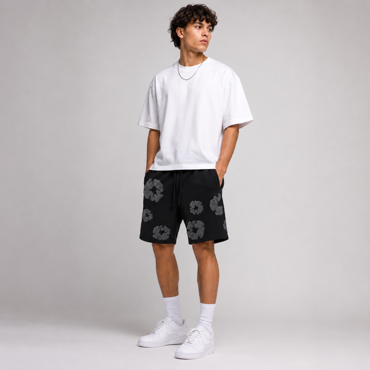 Black Grey Tonal Puff Floral men's mesh shorts - flat-lay view