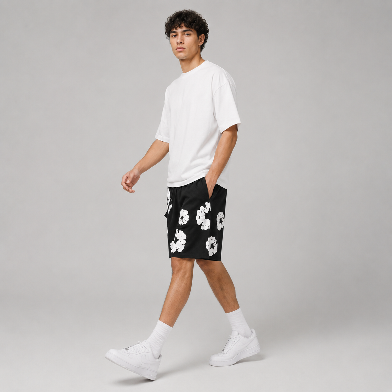 Black White Puff Floral mesh shorts - flat-lay view