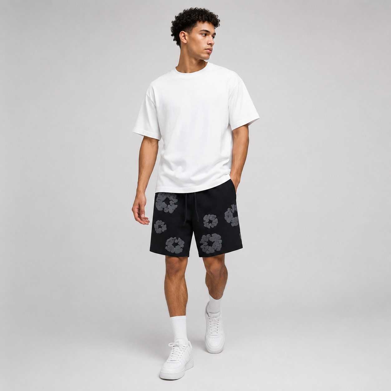 Black Grey Tonal Puff Floral men's mesh shorts - walking view