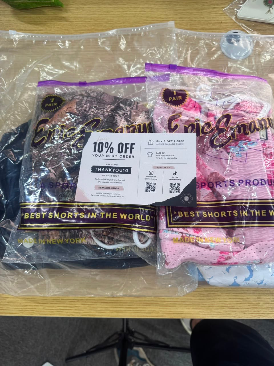 Two real EEMESH shorts orders with customer thank-you card