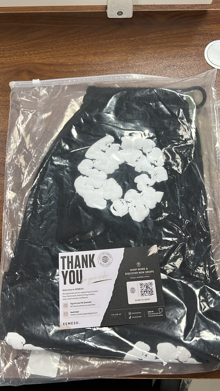 Black floral EEMESH shorts packed with branded insert